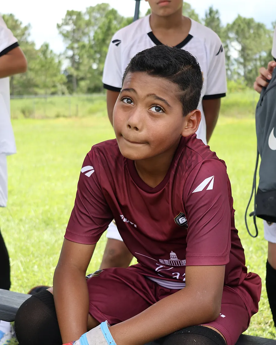 Goalkeeper resting on the bench